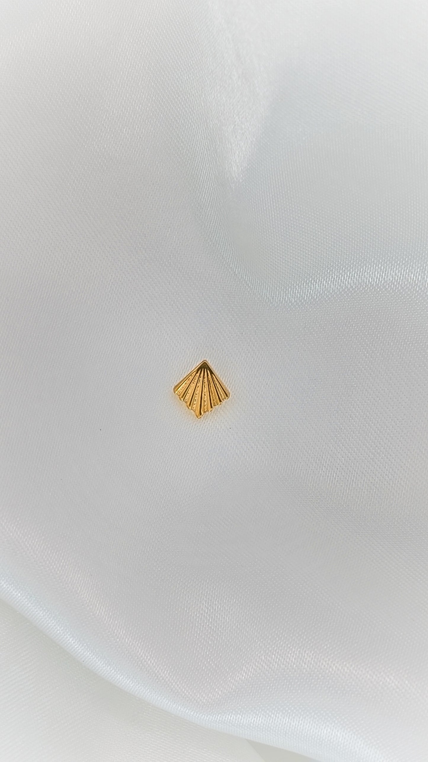 Golden Conch Shell Piercing